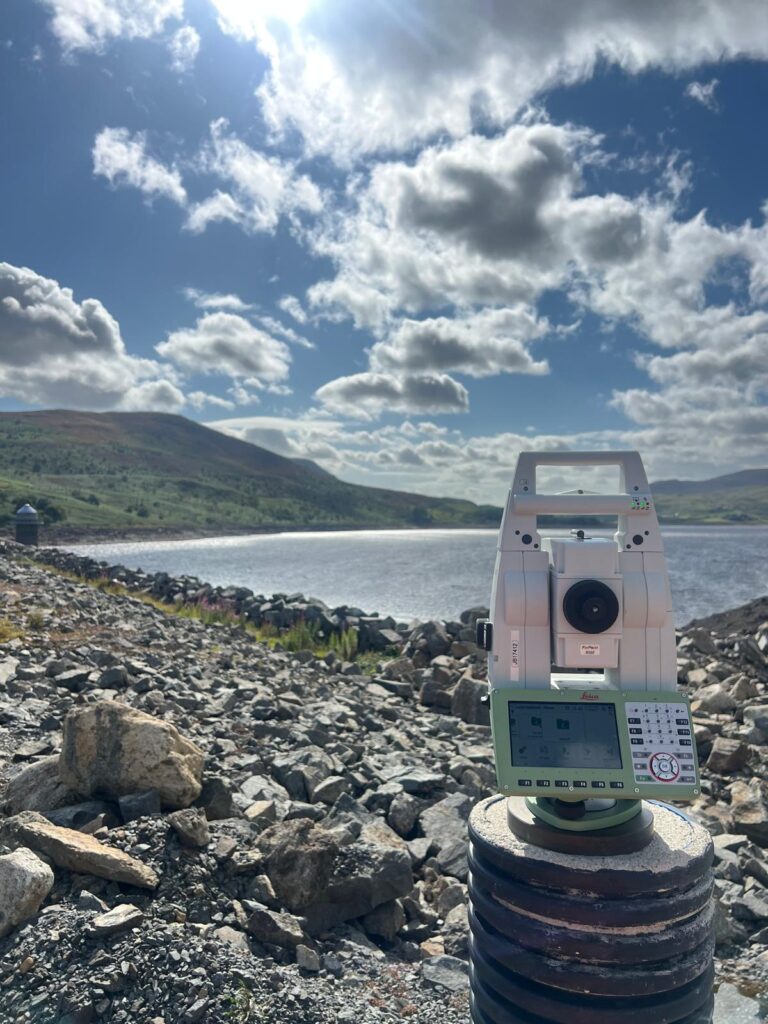 Surveying equipment overlooking a project site in North Wales